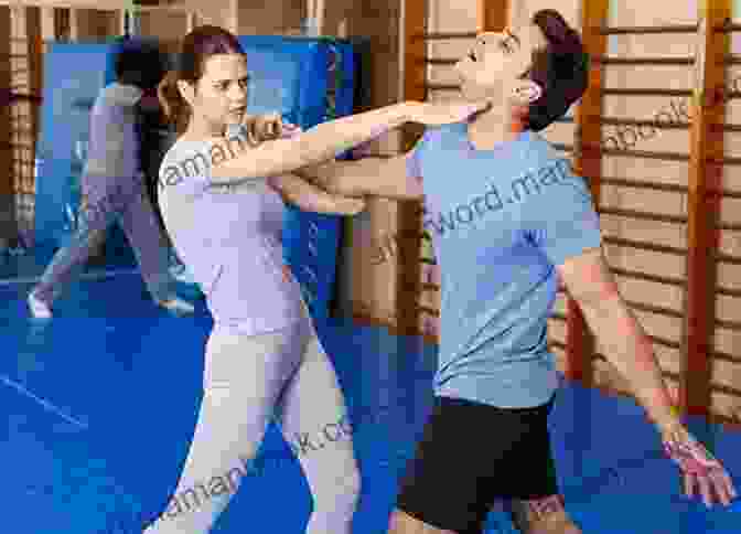 A Man And Woman Practicing Self Defense Techniques To Self Defense Concepts Report: Basic To Self Defense
