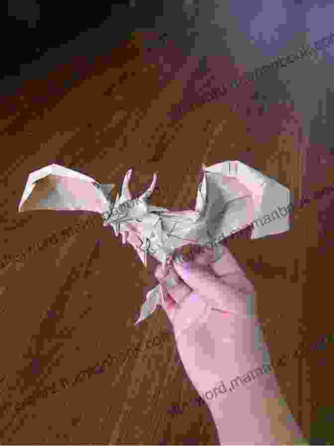 Man Showing Off An Intricate Origami Dragon Mini Money Origami Kit Ebook: Make The Most Of Your Dollar : Origami With 40 Origami Paper Dollars 5 Projects And Instructional DVD